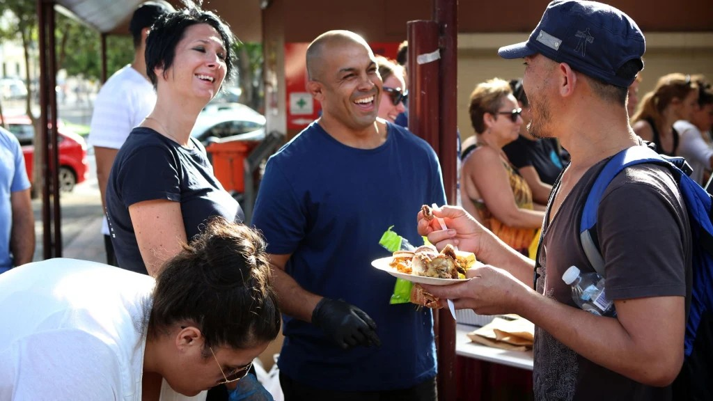 Ian Schaffa serving at a Street Buffet Sunday service